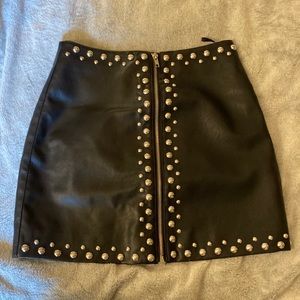 Studded mini skirt.